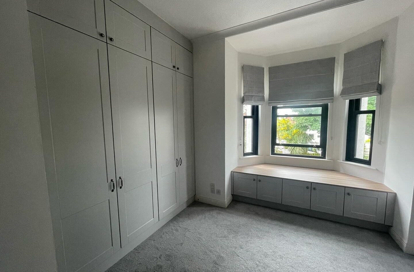 Light Grey Shaker Wardrobes with Oak Interior & Window Seat Storage hero