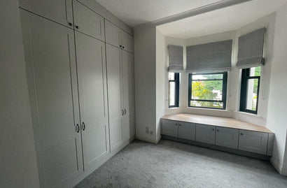 Light Grey Shaker Wardrobes with Oak Interior & Window Seat Storage